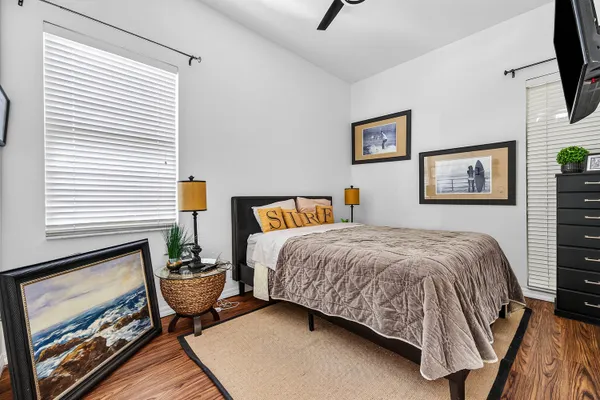 a bedroom with a bed and flat screen tv