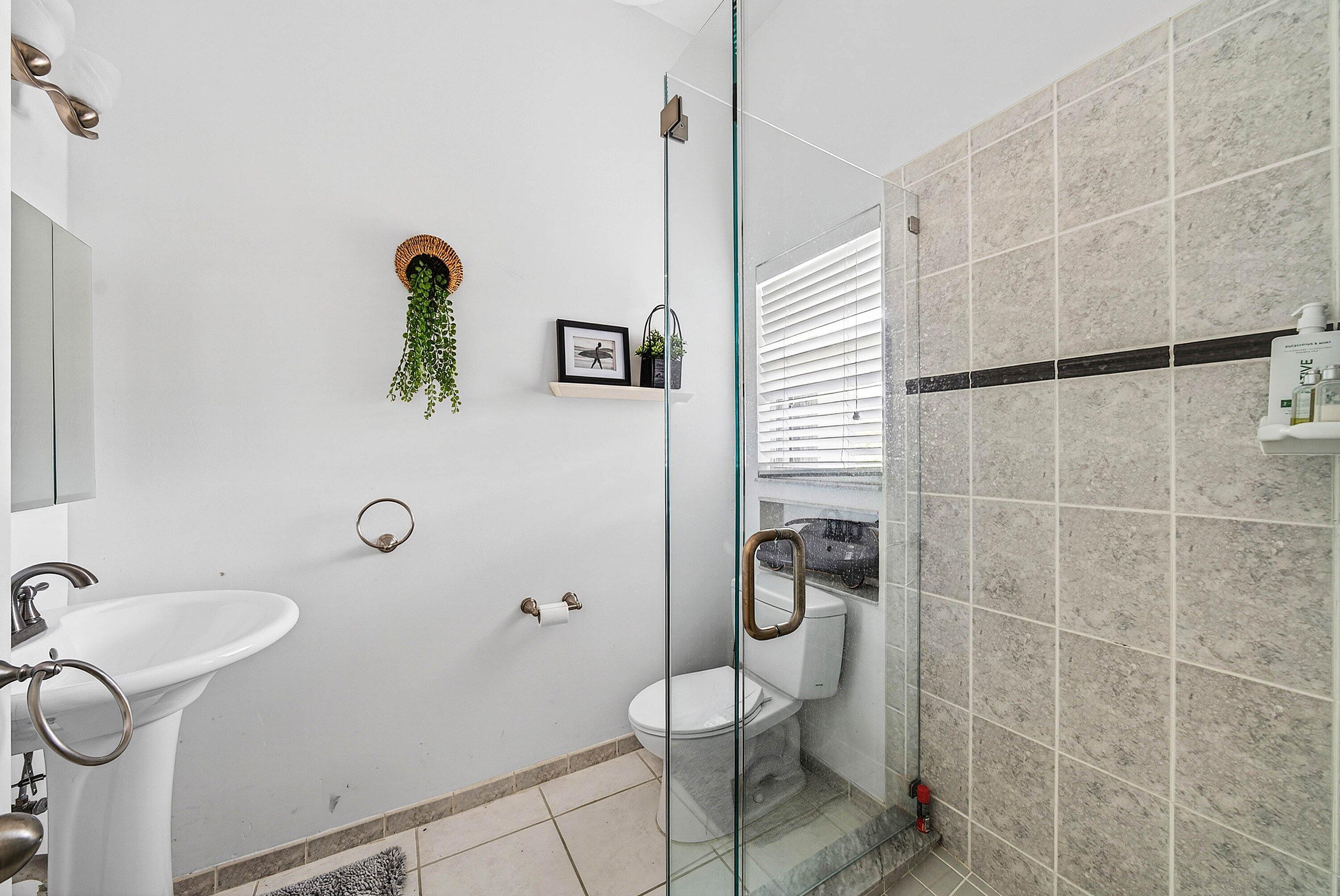 6601 Northwest 26th Way Boca Raton, FL 33496 - Photo 16 of 26 a bathroom with a shower and a sink