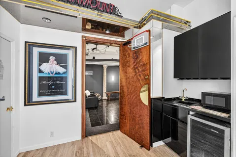 a view of a refrigerator and a flat screen tv