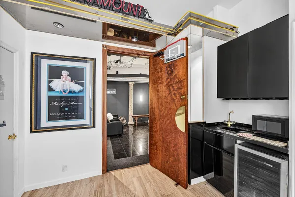 a view of a refrigerator and a flat screen tv
