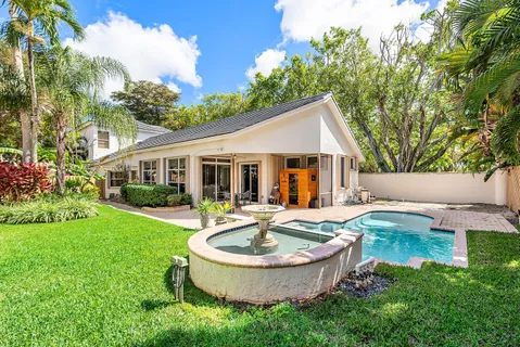 a front view of house with yard and outdoor seating