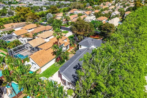 an aerial view of a house with a garden