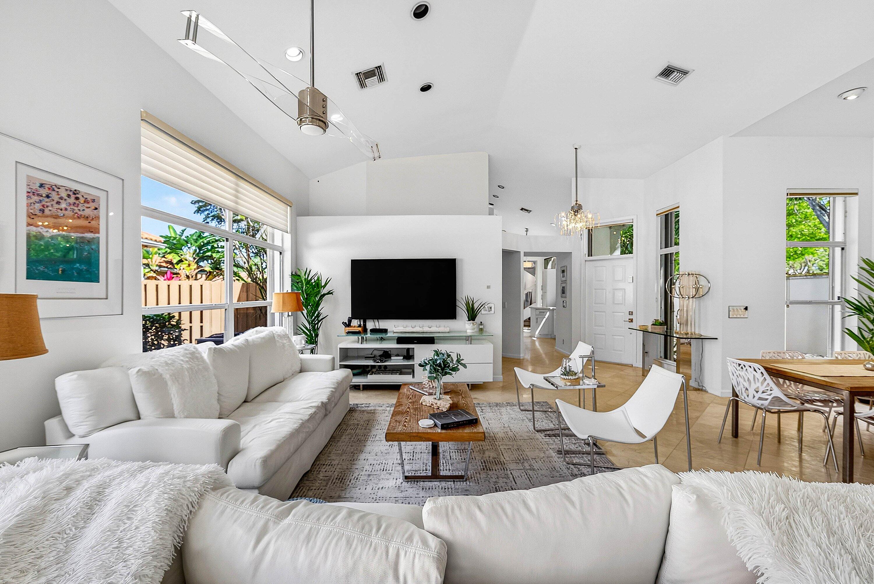 6601 Northwest 26th Way Boca Raton, FL 33496 - Photo 4 of 26 a living room with furniture and a flat screen tv
