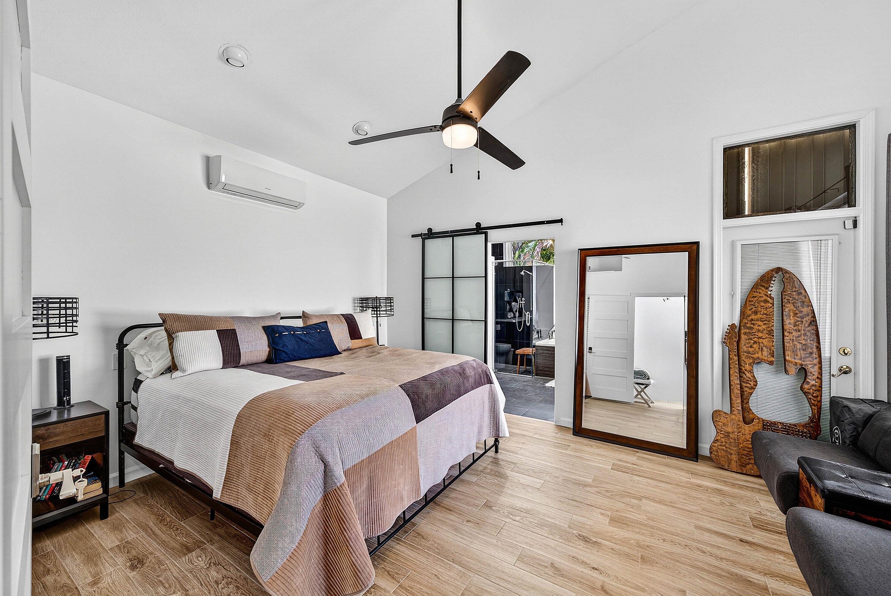 6601 Northwest 26th Way Boca Raton, FL 33496 - Photo 10 of 26 a bed room with a bed and a chandelier