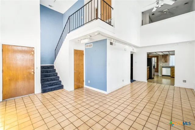 a view of an empty room with a fireplace