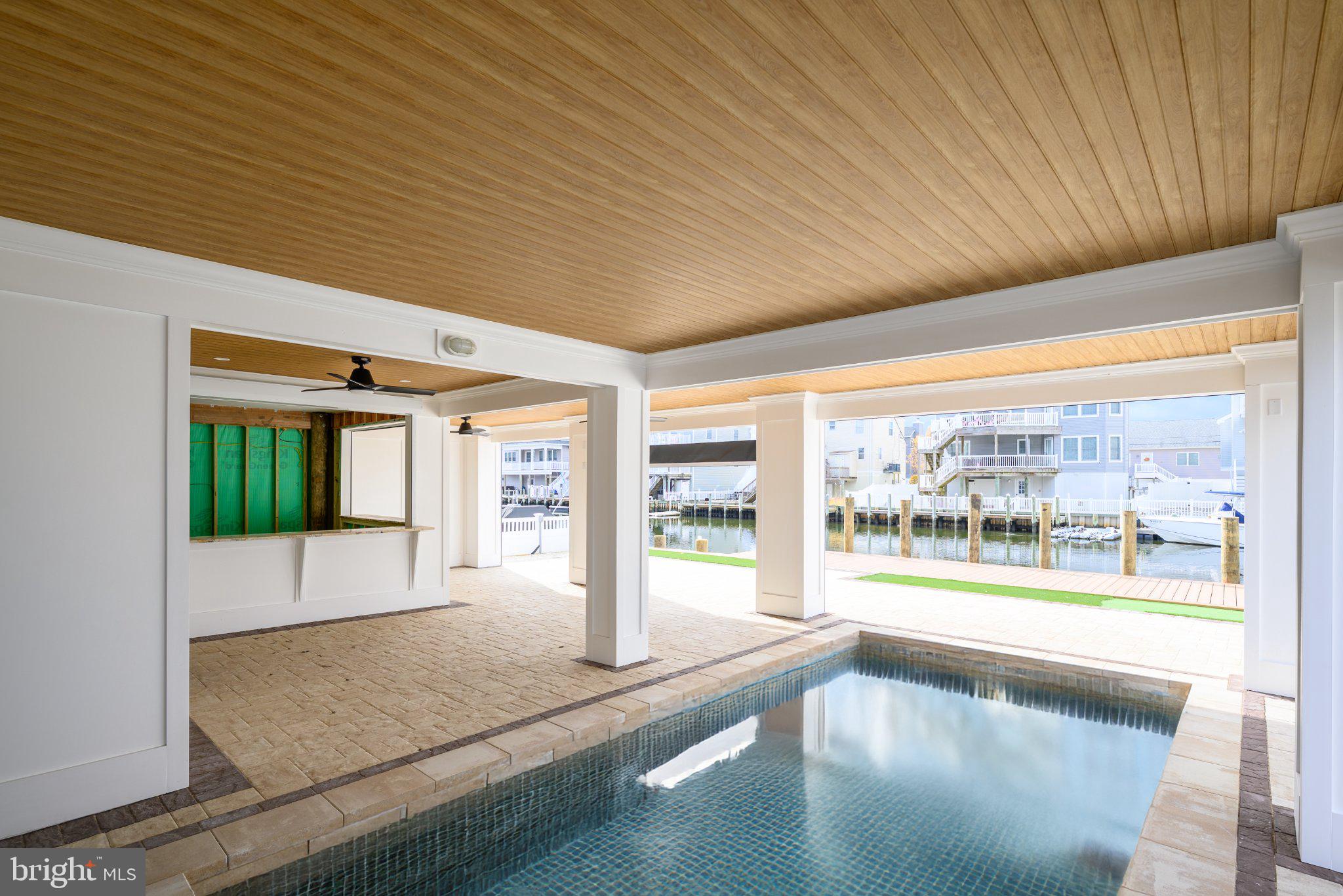2128 Mill Creek Road Manahawkin, NJ 08050 - Photo 3 of 4 Serene indoor pool with waterfront views.