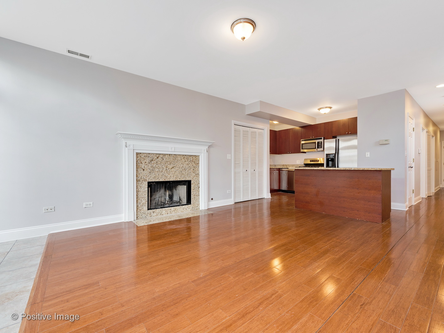 526 North May Street, Unit 1 Chicago, IL 60642 - Photo 2 of 15 a view of a kitchen with a sink cabinets and a fireplace