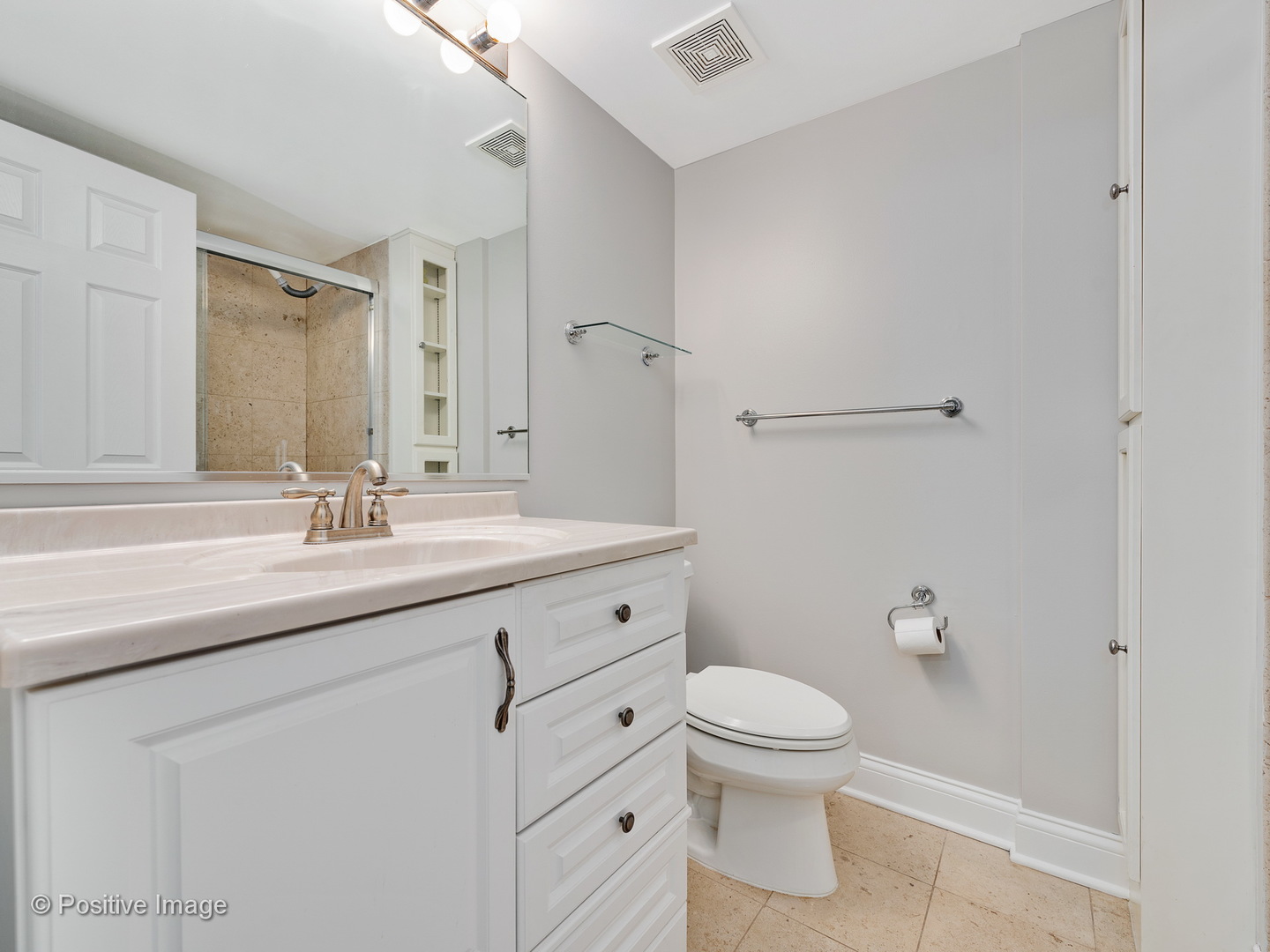 526 North May Street, Unit 1 Chicago, IL 60642 - Photo 12 of 15 a bathroom with a granite countertop sink a toilet and a mirror
