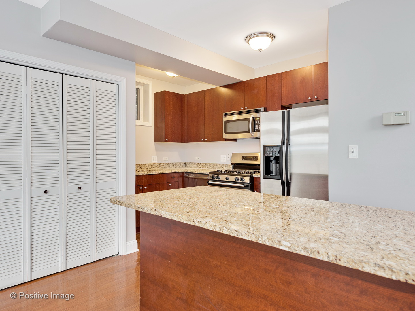 526 North May Street, Unit 1 Chicago, IL 60642 - Photo 5 of 15 a large kitchen with a refrigerator a sink and dishwasher