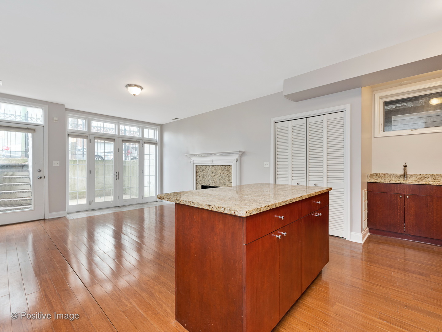 526 North May Street, Unit 1 Chicago, IL 60642 - Photo 7 of 15 a kitchen with granite countertop a sink and a stove