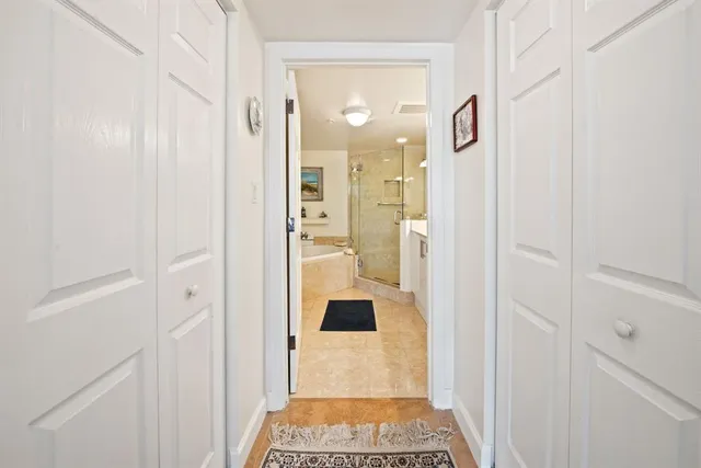 a bathroom with a glass shower door