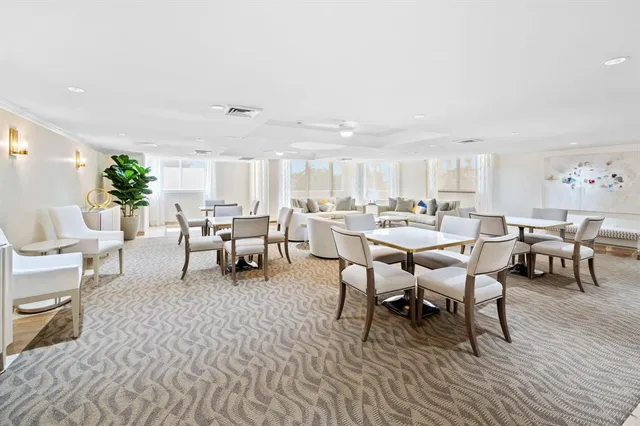 a view of swimming pool with outdoor seating