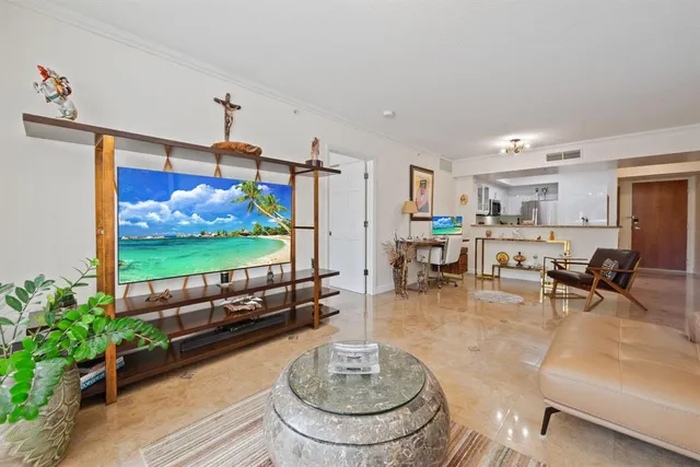 a living room with furniture and a flat screen tv