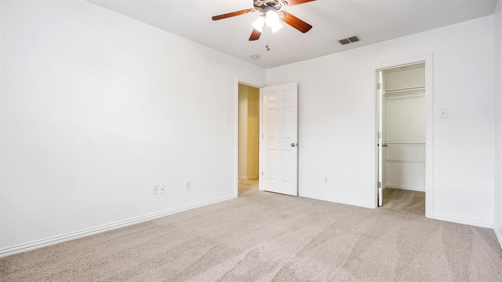 3206 Bedford Road Bedford, TX 76021 - Photo 17 of 26 an empty room with closet and a chandelier fan