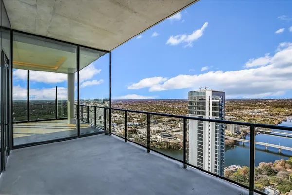 a view of a balcony with city