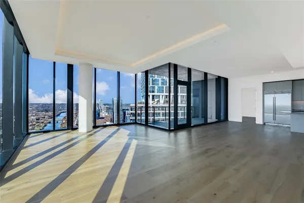 a view of a living room with windows