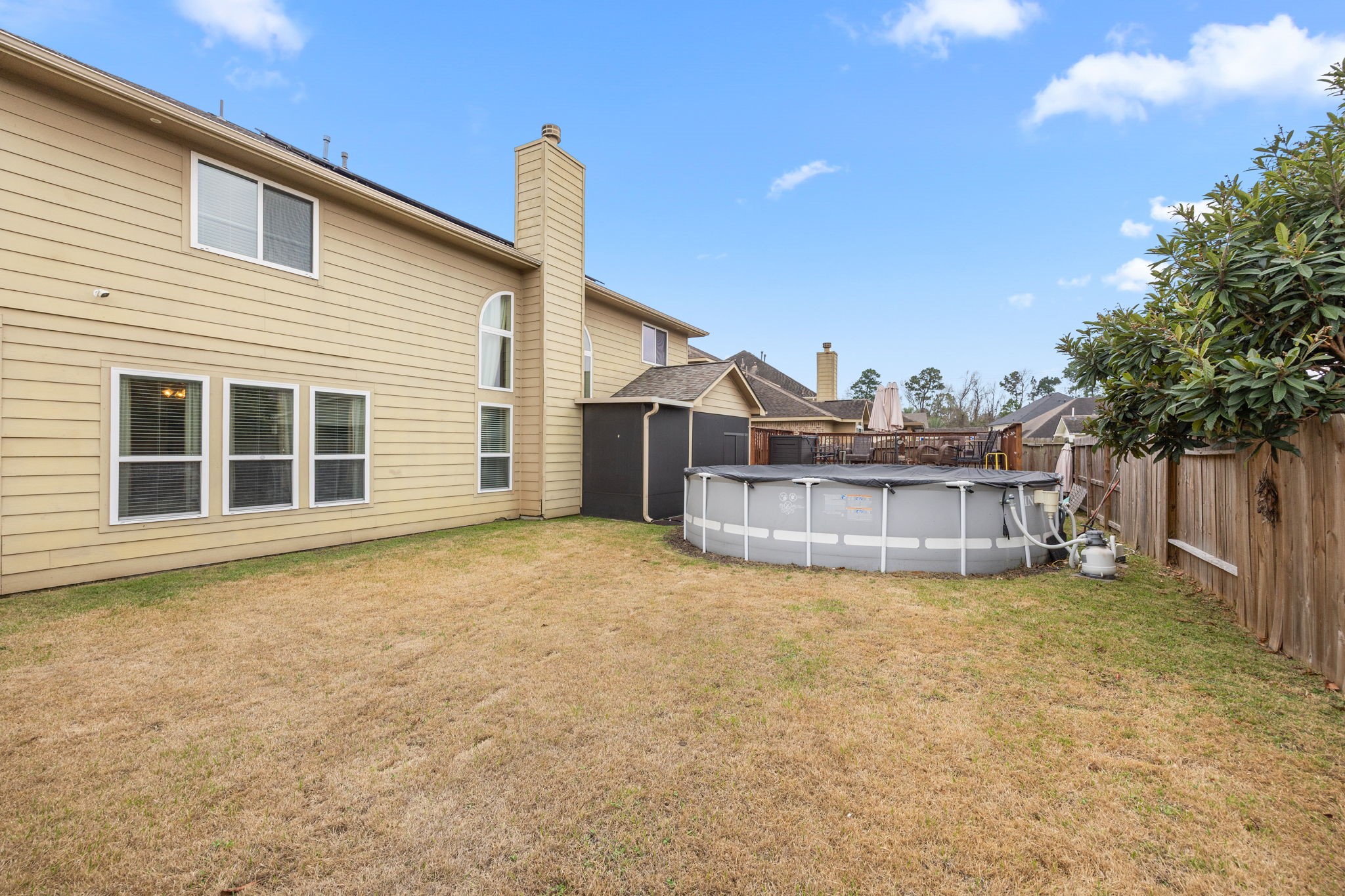 6719 Latchmore Lane Houston, TX 77049 - Photo 44 of 46 a view of a house with a big yard and potted plants