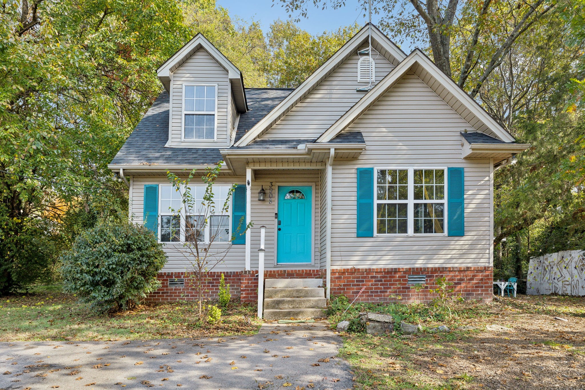 3908 Taylor Road Nashville, TN 37211 - Photo 1 of 42 a front view of a house with garden
