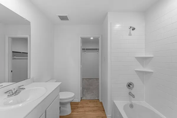 a bathroom with a sink toilet and shower