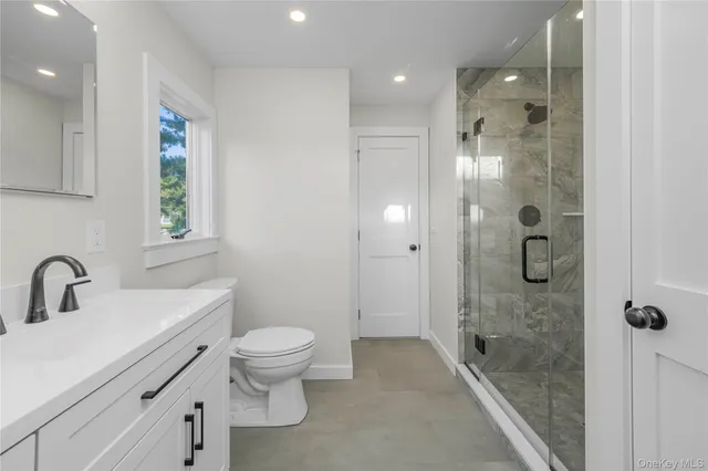 a bathroom with a sink vanity and mirror