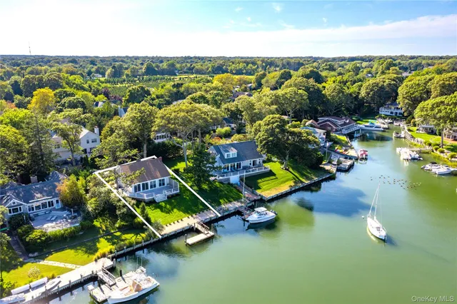 an aerial view of a house with a swimming pool yard and outdoor seating