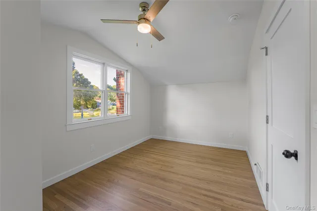 a bathroom with a sink a toilet a mirror and shower