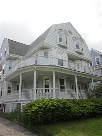 172 Powder House Boulevard Somerville, MA 02144 - Photo 3 of 3 a front view of a house with garden