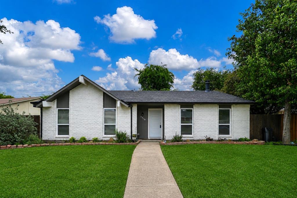 7318 Emory Oak Lane Dallas, TX 75249 - Photo 2 of 28 Ranch-style residence featuring a white painted brick facade and a dark shingle roof