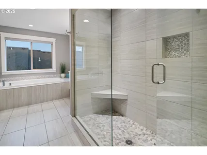a bathroom with a glass shower door