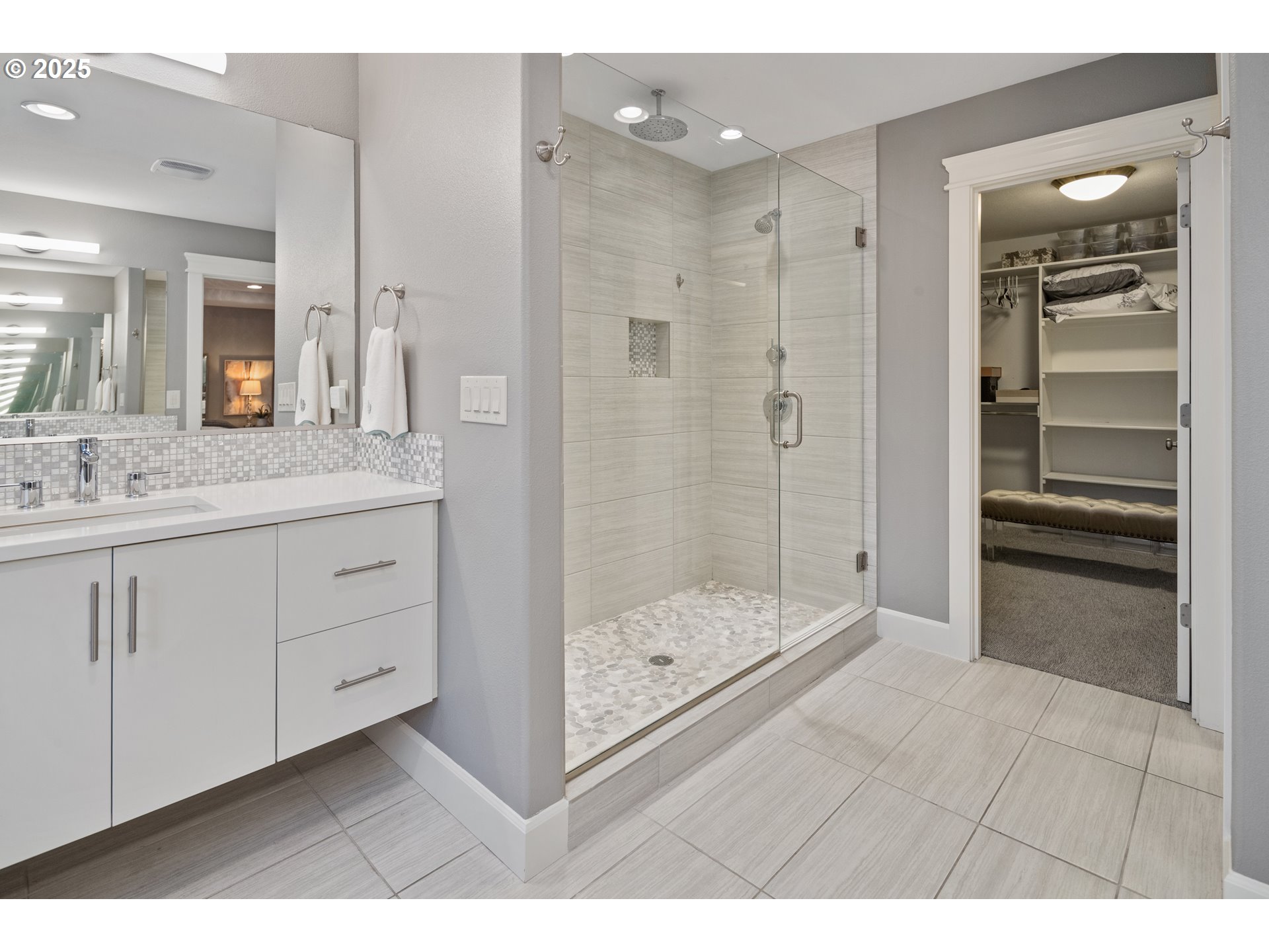 3602 Northwest 107th Street Vancouver, WA 98685 - Photo 13 of 27 a bathroom with a shower sink and mirror