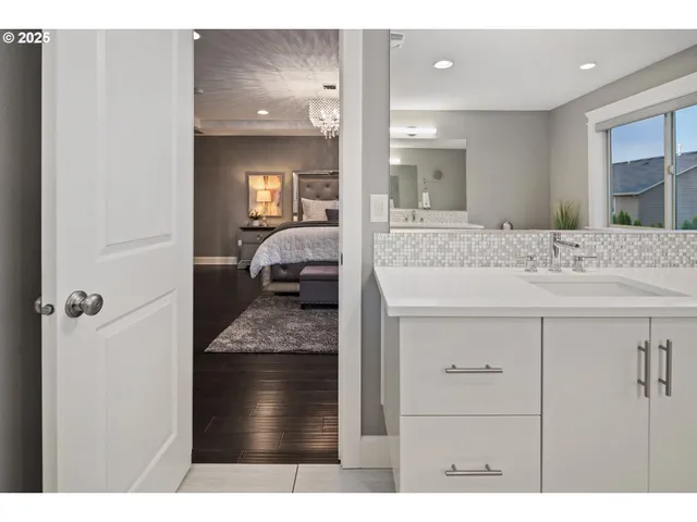 a en suite bathroom with a sink and mirror