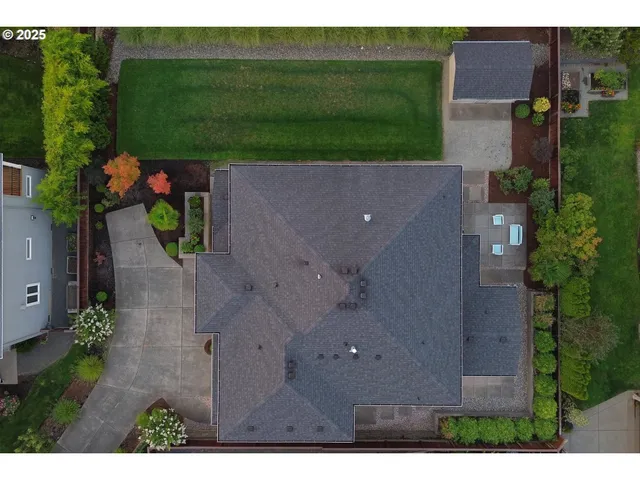 an aerial view of a house with outdoor space and street view