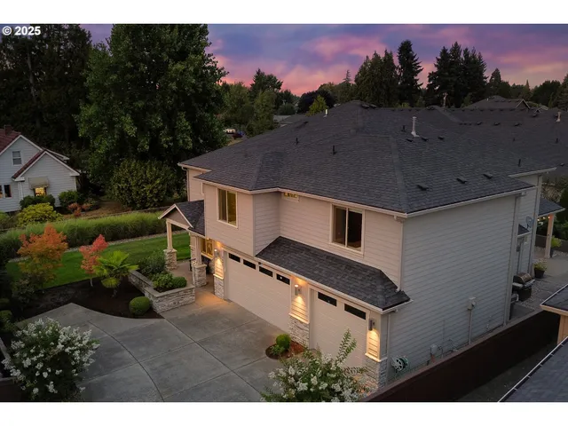 a aerial view of a house with a yard