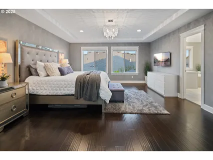 a spacious bedroom with a bed and window