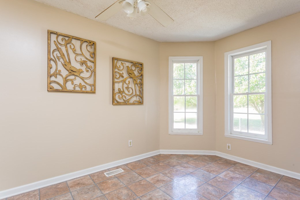 796 Old Eason Road Zebulon, NC 27597 - Photo 5 of 11 The breakfast room and kitchen are open to the family room which offers a gas FIRE PLACE and plenty of windows for natural lighting. Breakfast Area