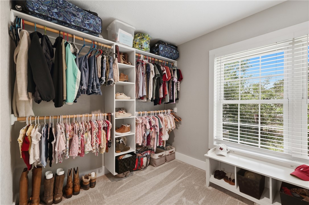 515 Crescent Drive Bryan, TX 77801 - Photo 23 of 43 Custom primary walking closet featuring multiple hanging rods and integrated shelving