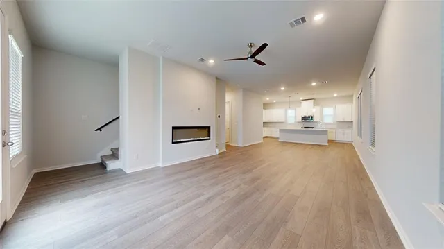 a view of a kitchen with a sink and a stove top oven