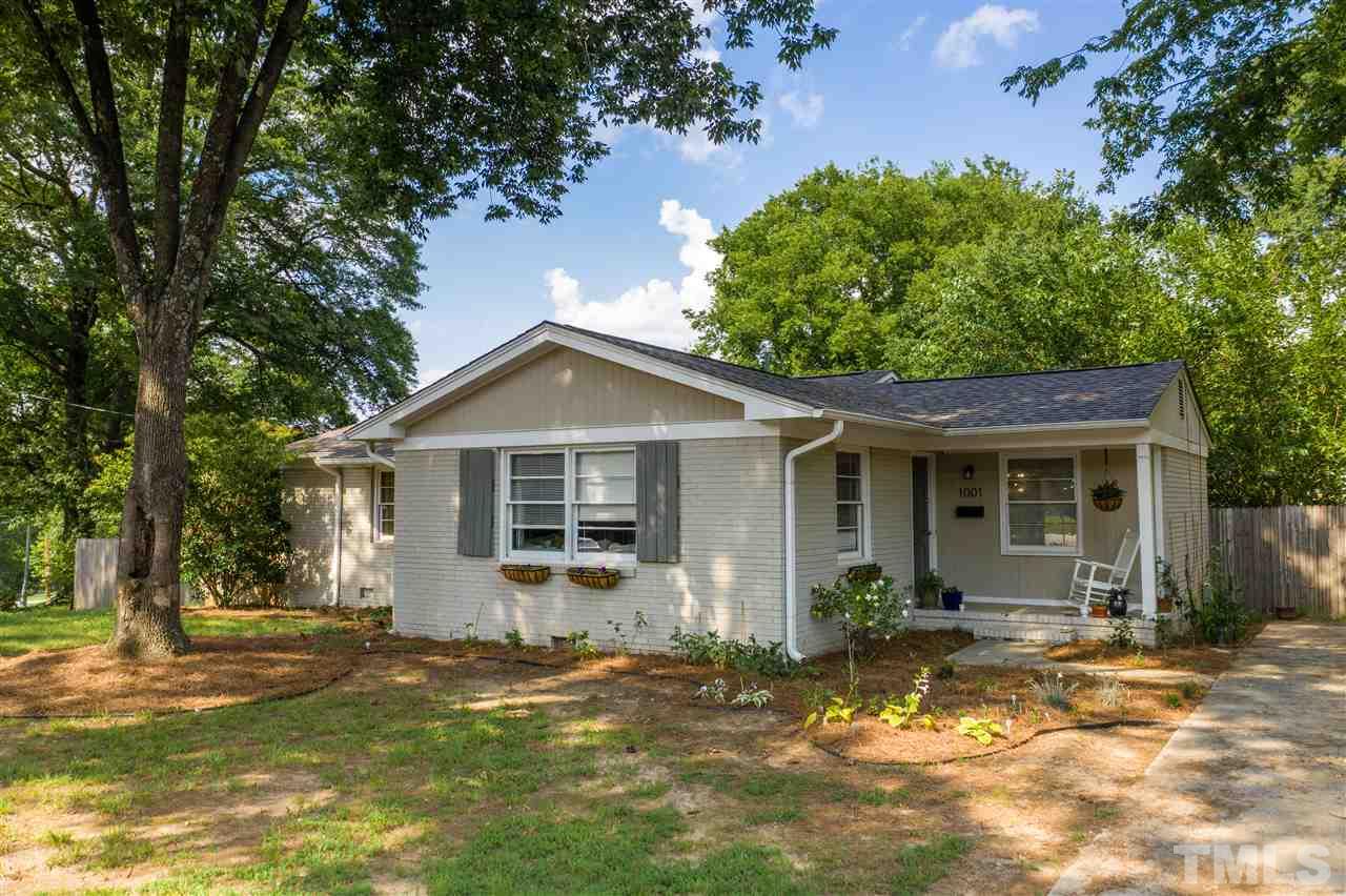 1001 Caspan Street Raleigh, NC 27610 - Photo 1 of 30 a front view of a house with a yard