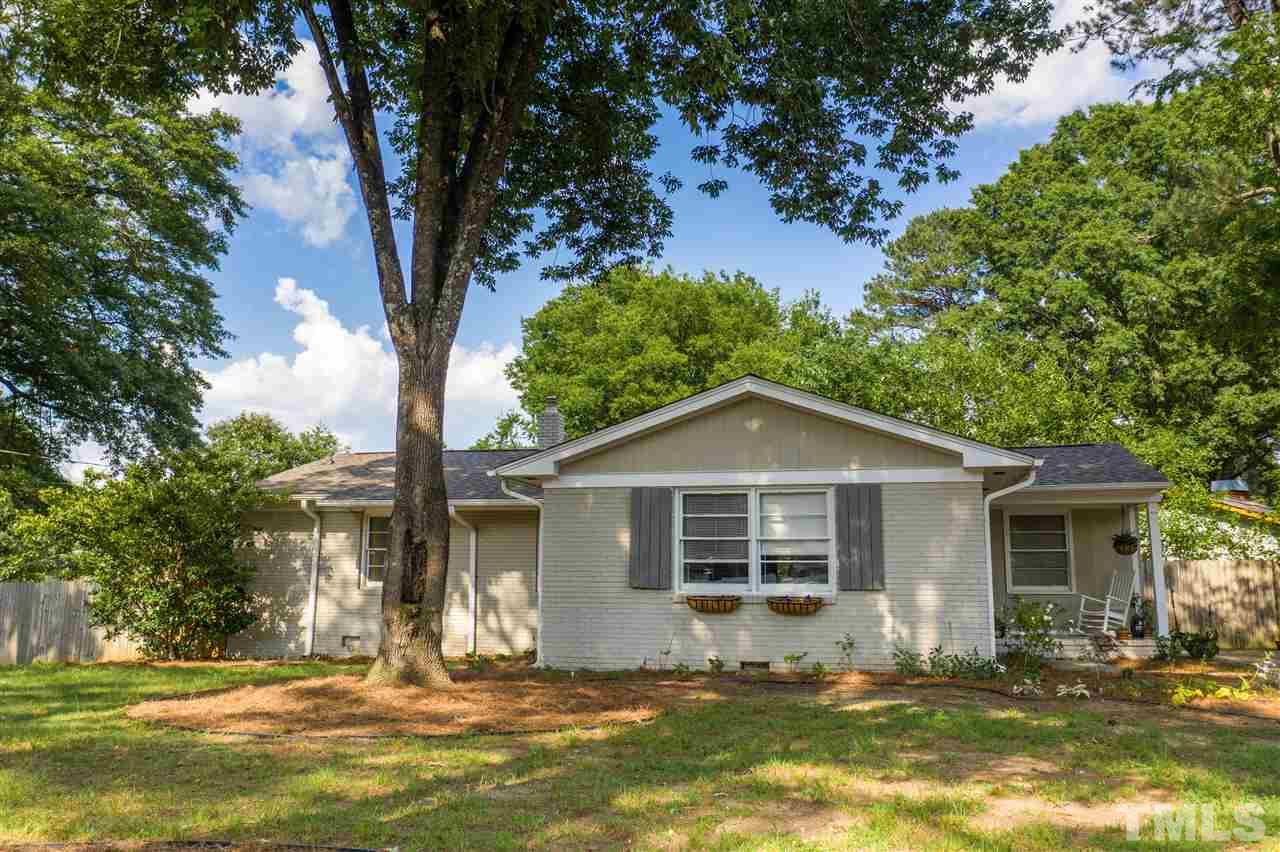 1001 Caspan Street Raleigh, NC 27610 - Photo 2 of 30 a front view of a house with a yard