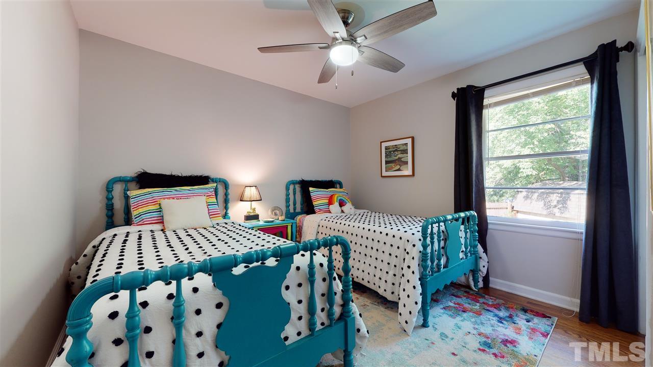 1001 Caspan Street Raleigh, NC 27610 - Photo 15 of 30 a bedroom with a bed and a window