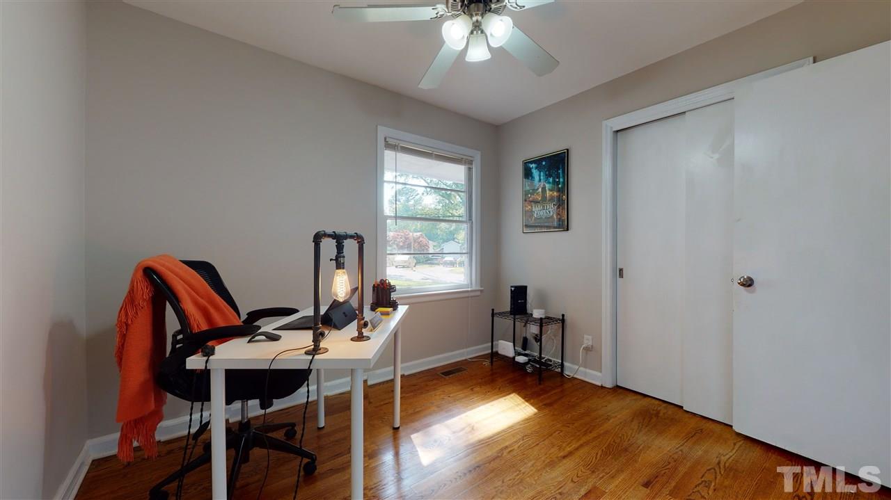 1001 Caspan Street Raleigh, NC 27610 - Photo 18 of 30 a view of a workspace with furniture and a window
