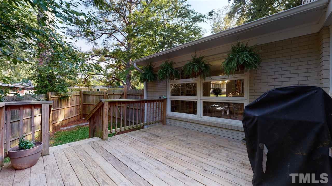 1001 Caspan Street Raleigh, NC 27610 - Photo 19 of 30 a view of a house with backyard and sitting area