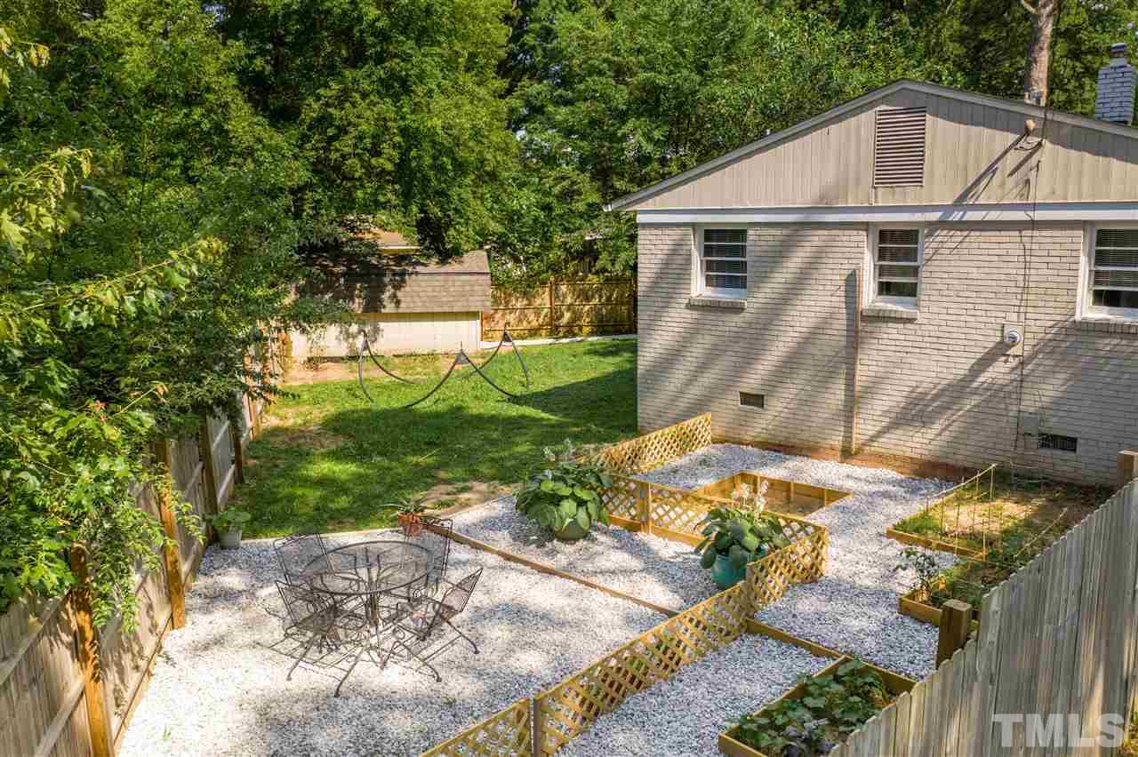 1001 Caspan Street Raleigh, NC 27610 - Photo 22 of 30 a view of a back yard of the house