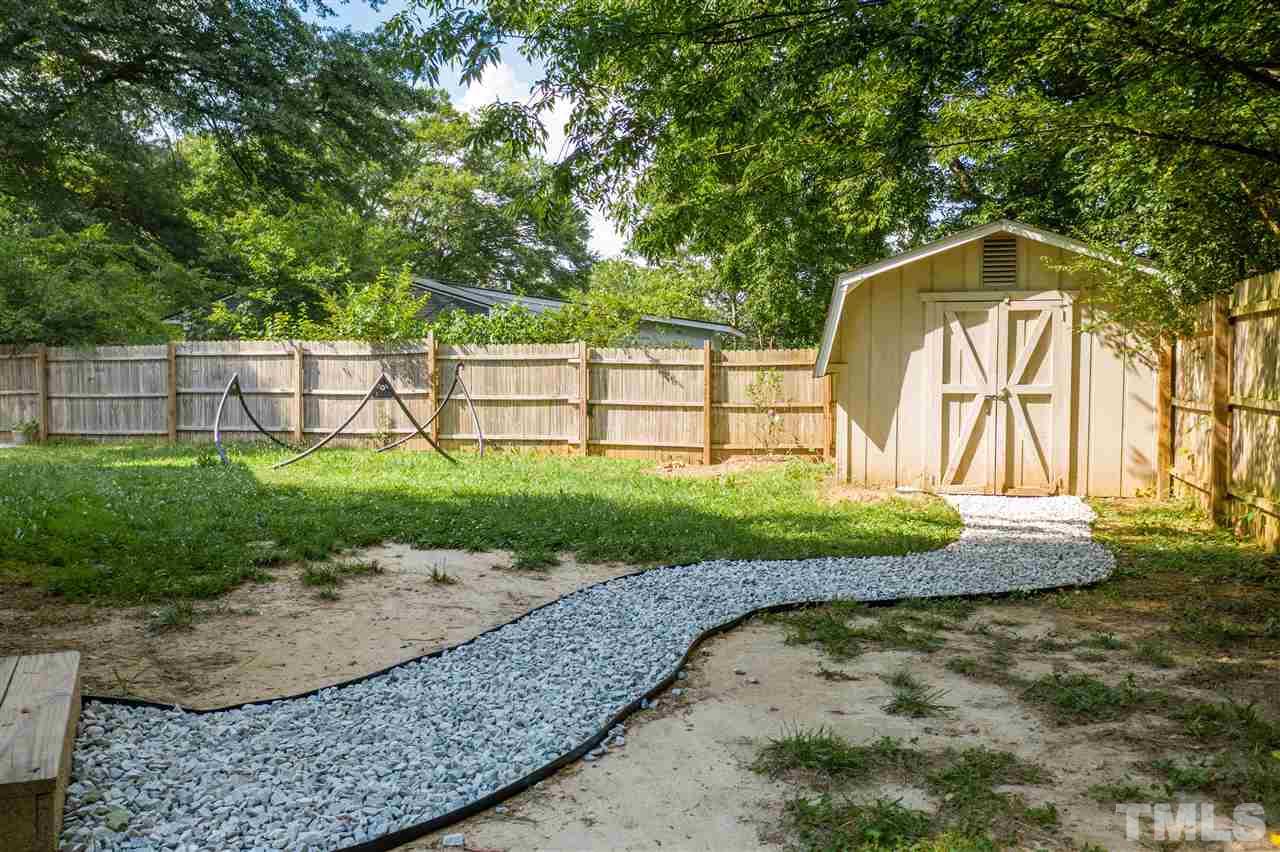 1001 Caspan Street Raleigh, NC 27610 - Photo 24 of 30 a view of a garden with a pathway