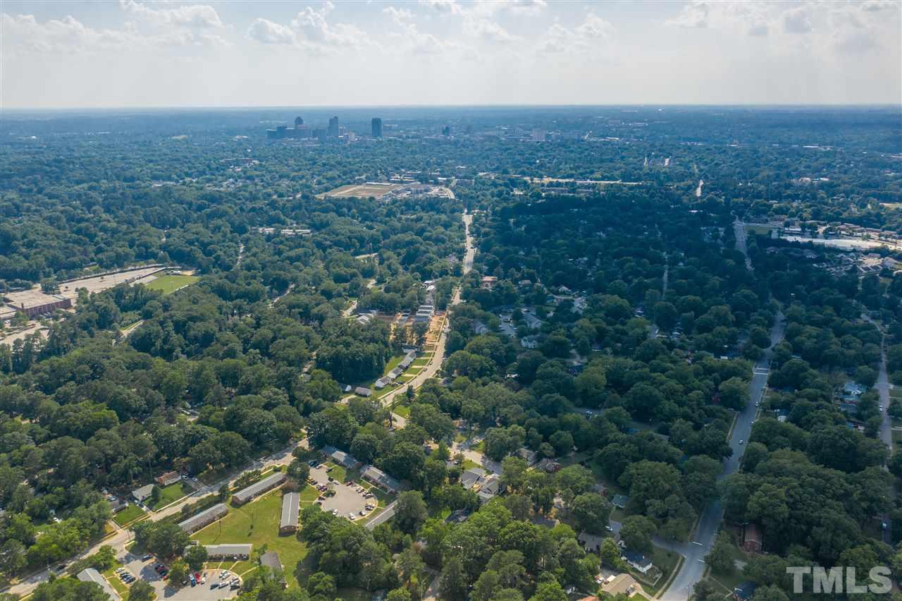 1001 Caspan Street Raleigh, NC 27610 - Photo 29 of 30 an aerial view of residential houses with outdoor space and trees