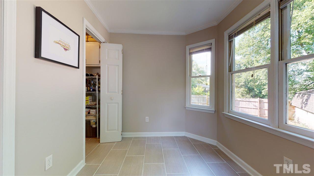 1001 Caspan Street Raleigh, NC 27610 - Photo 10 of 30 an empty room with windows