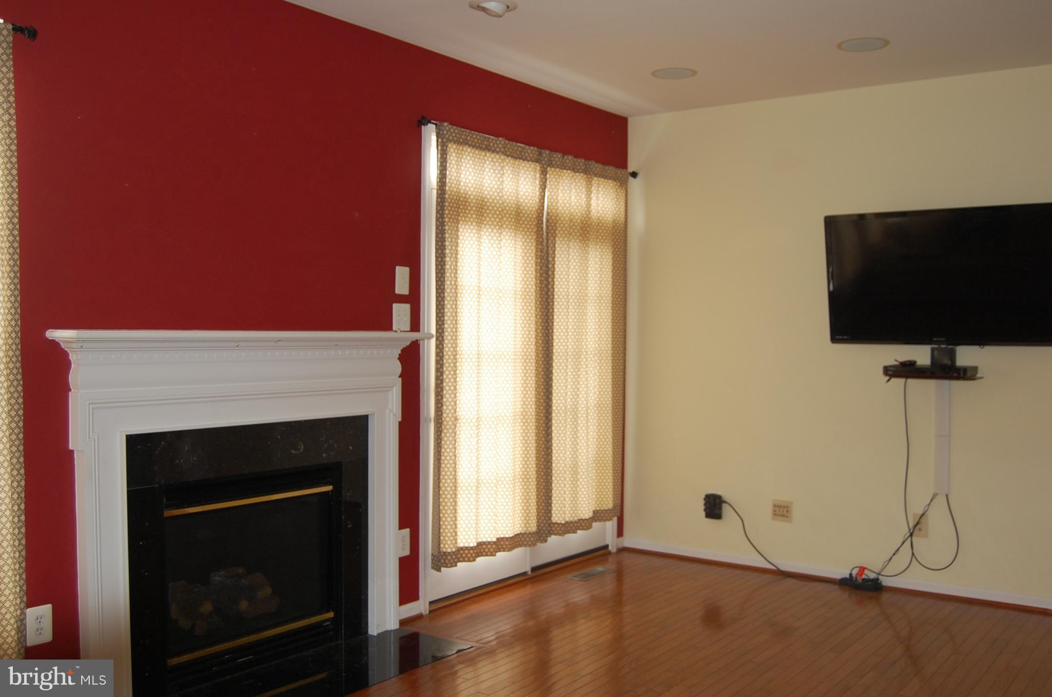 183 Riparian Lane Ranson, WV 25438 - Photo 11 of 22 Family Room with double doors to patio