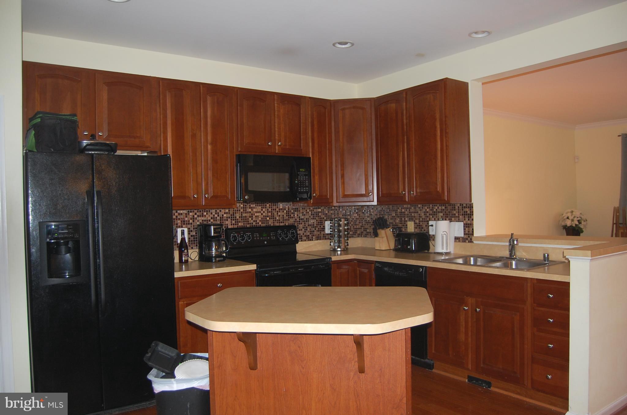 183 Riparian Lane Ranson, WV 25438 - Photo 7 of 22 Open kitchen with island