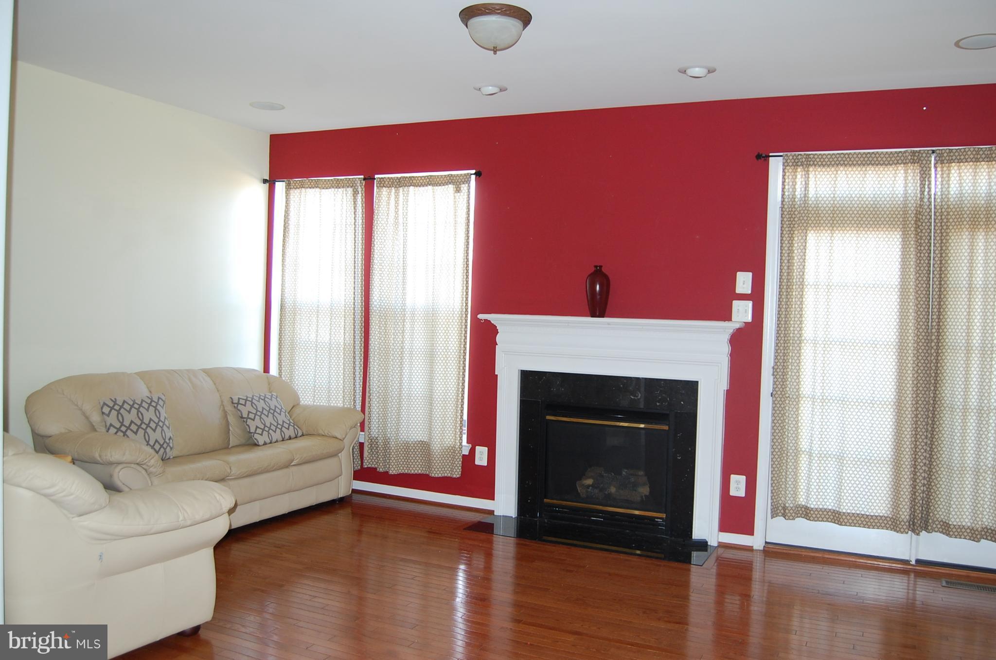 183 Riparian Lane Ranson, WV 25438 - Photo 9 of 22 Spacious family room with fireplace