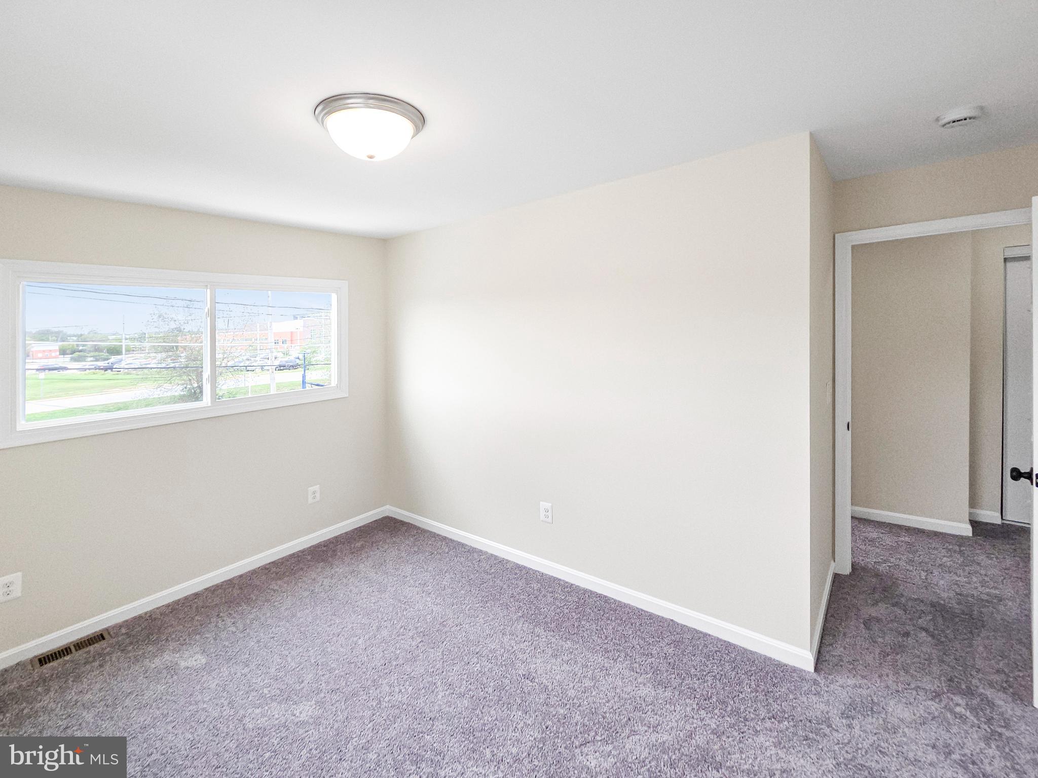 6516 Columbia Park Road Landover, MD 20785 - Photo 12 of 25 an empty room with windows